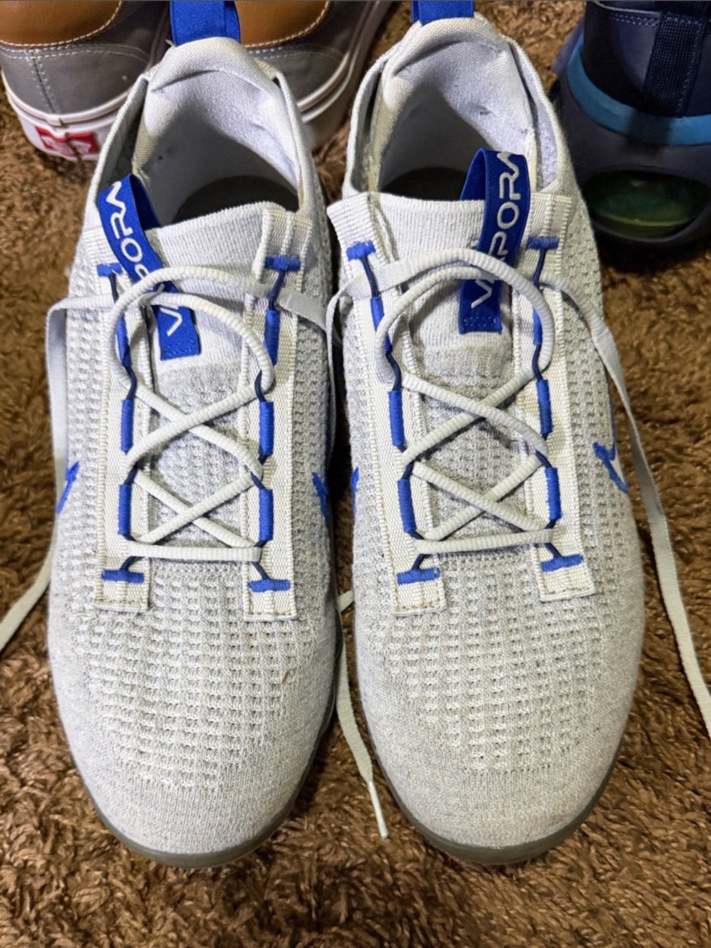 Nike Men’s White Athletic Sneakers with Blue Accents
